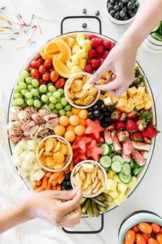 two people are serving food on a platter with the words instagramn above them