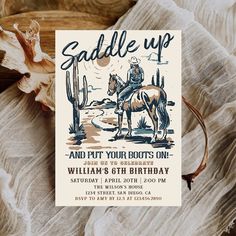 a birthday card with an image of a cowboy riding a horse and cactus in the background