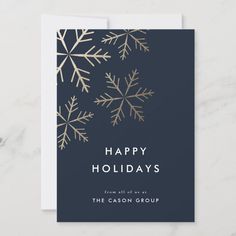 a holiday card with gold snowflakes on it