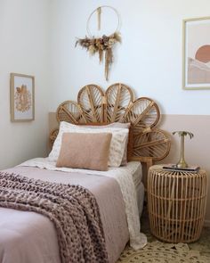 a bedroom with wicker headboard and rattan bedding in neutral tones,