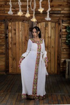 √ 100% Handmade √ 100% Cotton made √ it looks so cute when you wear it √ Very comfortable √ its made very carefully √ A very ideal gift to give √ Ethiopian dress √ 55 inchs Long(Shoulder to Bottom) and from shoulder to shoulder 15 Inches. Ethiopian long dress, Ethiopian Clothing, Ethiopian Cultural dress, Habesha Dress, Ethiopian Cultural Dress, Hager Libs, Abelfashion, Ethiopian gift, Eritrean Dress, Eritrean gift, Eritrea, Black Friday Sale, Ethiopian Fashion, Habesha Fashion, Ethiopian dress. Ethiopia Dress, Rastafarian Women, Ethiopian Fashion, Eritrean Dress, Cultural Dress, Ethiopian Wedding, Ethiopian Clothing, Habesha Dress, Ethiopian Traditional Dress