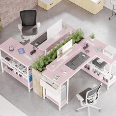 an aerial view of a pink office desk with plants growing out of the cubicle