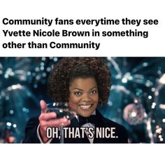 a woman in a tuxedo holding a wine glass with the caption, community fans everywhere they see yete nicole brown in something other than community