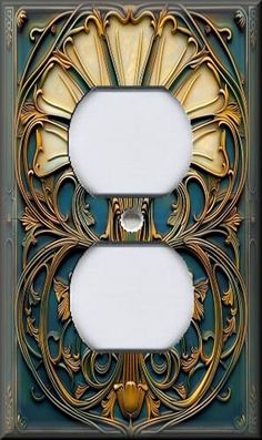 an ornate light switch plate cover in gold and green