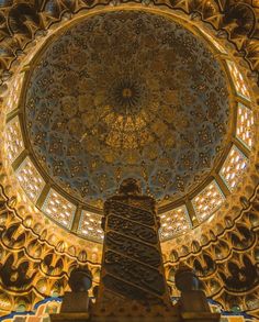 an ornate ceiling in the middle of a building