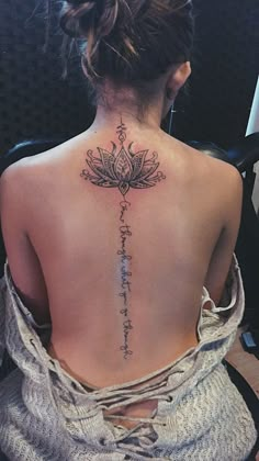 a woman with a tattoo on her back