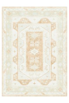 a beige and white rug with an intricate design