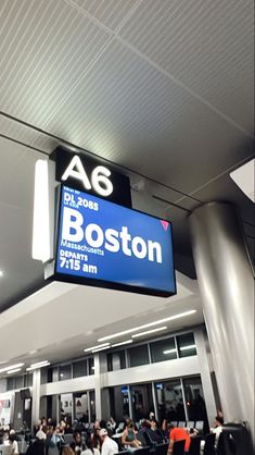 people are sitting at the airport waiting for their flight