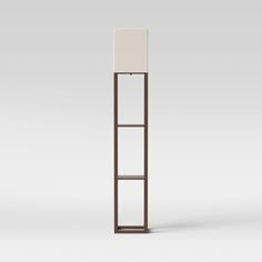 a tall wooden shelf with a white cloth on top and a light brown frame around it