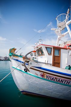 a white and blue boat in the water