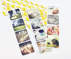 yellow straws and stickers with pictures on them sitting next to some paper straws