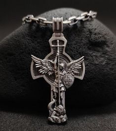 Silver medallion of the Archangel Michael.  Made of 925 sterling silver.  This handmade necklace will be a great gift and decoration for every day.  The clear details of the necklace and the high quality of the piece will attract everyone's attention. ★Item Details * Gender : Male / Female * Material : 925K Sterling Silver * Pendant weight : 18 - 20 Grams * Pendant Diameter : 6.2 cm x 3.2cm (2.3622 x 1.1811 inc) * Bail Width : Suitable for up to 0,275591 Inc (7.00 mm) Chain * Chain Thickness : 0 St Michael Medallion, St Michael Necklace, Cross Pendant Men, Saint Michael The Archangel, Necklaces For Men, San Michele, Saint Michael, Archangel Michael