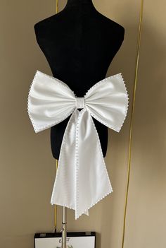 Friends, welcome to my store. https://www.etsy.com/uk/listing/1601619992/additional-fees If you are unsure of the colour, please purchase a colour sample to match.             Our bows are unique and can be paired with belts. This gives you a variety of options for pairing, click this link to purchase your belt. https://www.etsy.com/uk/listing/1684345476/romantic-strappy-belts-in-various-colors Our wedding bows can be customized according to your needs, you can provide the size and different col Elegant Bridal Belt With Satin Bow For Party, White Bridal Accessories With Satin Bow For Party, White Ribbon Bridal Belt For Party, Elegant Wedding Sashes With Decorative Bow, Satin Bow Tie For Wedding, White Ribbon Bow Tie For Party, White Satin Bow Tie For Wedding, White Detachable Bow Tie For Wedding, White Bow Tie With Detachable Bow For Wedding