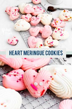 heart - shaped meringue cookies on a cooling rack with pink frosting and sprinkles