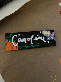 a black sticker with the word corfin written in white and orange on it