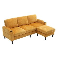 a yellow couch and ottoman sitting next to each other