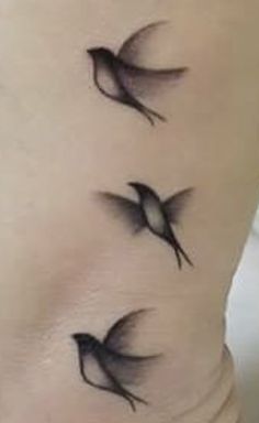 three birds on the side of a woman's stomach