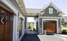 a house that has two garages in front of it