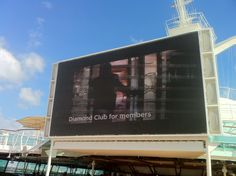 a large billboard on the side of a cruise ship advertising diamond club for members,