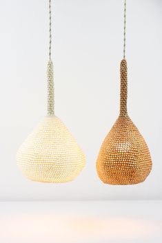 two hanging lights made out of woven material