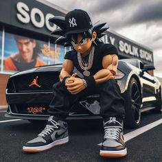 a young man sitting on top of a car in front of a store with his arms crossed