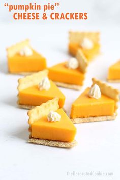 small slices of cheesecake with whipped cream on top are arranged in the shape of triangles