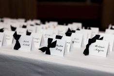 black and white place cards on a table