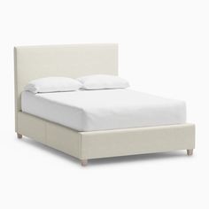 a bed with white linens and pillows on it's headboard, in front of a white background