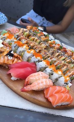 sushi platter with various types of seafood on it