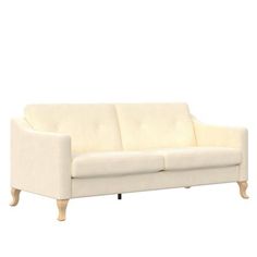 a white couch sitting on top of a wooden floor