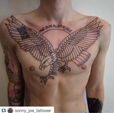 a man with an eagle tattoo on his chest