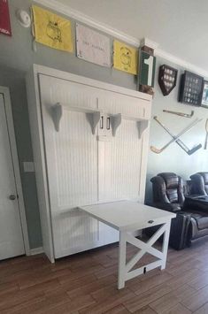 a living room filled with furniture and a white table