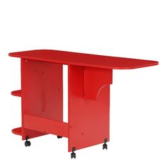 a red table with wheels on the bottom and an open shelf underneath it for storage