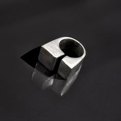 This geometric statement ring for professionals features a bold design perfect for modern industrial jewelry enthusiasts. It's an ideal friend gift for women who appreciate silver chunky rings and modern geometric jewelry.  𝐒𝐈𝐙𝐄: ➤ US Sizes 6.5-10 If you do not know your size, please read the FAQ (bottom of the page) or contact Rannka.  𝐃𝐄𝐓𝐀𝐈𝐋𝐒: ➤ Material: Mixed Metal, Pewter, Oxidized Silver Finish Nickel Free, Lead Free & Hypoallergenic, Non Tarnish ➤ Made to order - ships in 3-4 w Modern Geometric Jewelry, Industrial Jewelry, Chunky Ring, Bold Rings, Statement Accessories, Leather Ring, Chunky Rings, Geometric Jewelry, Oxidized Silver