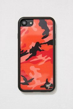 an orange and black camouflage iphone case on a white surface