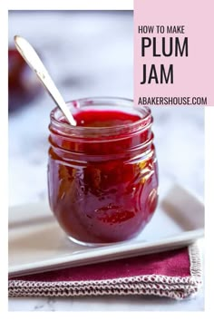 homemade plum jam in a glass jar with a spoon on the side and text overlay that reads homemade plum jam