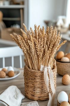 a basket filled with eggs sitting on top of a wooden table next to other items