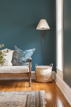 a living room with blue walls and wooden floors