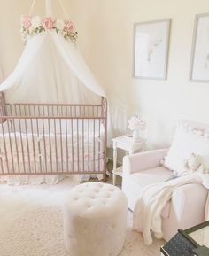 a baby's room is decorated in white and pink