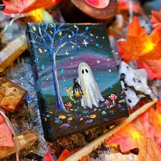 a painting of a ghost holding a pumpkin