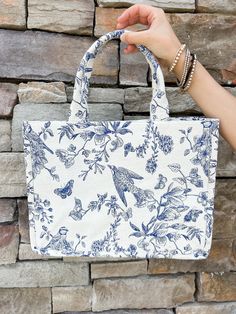 Elevate your summer fashion game with Shiraleah's Amanda Tote! This chic and sturdy canvas bag boasts a stunning, feminine floral print that adds a touch of elegance to any outfit. Its bold colors and strong construction make it the perfect accessory for seasons to come. Complement your style with other Shiraleah pieces! Features include cotton fabric, double handles, a magnetic snap closure, and inner zip and slip pockets. Sweet Grace Candle, Teacher Gift Card, Casual Work Wear, Pink Pineapple, Blue Tote, Star Spangled, Next Clothes, Capri Blue, Bridal Gifts