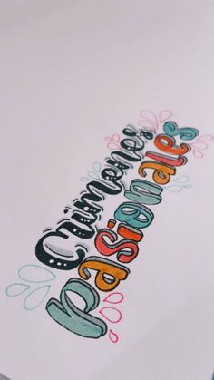 an image of the back side of a white paper with colorful lettering that reads, celebrate