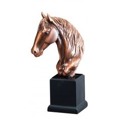 a bronze colored horse head on a black base with a white back ground and one side facing the viewer