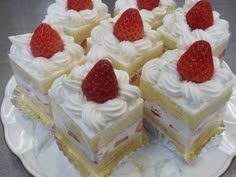 several pieces of cake with strawberries on top