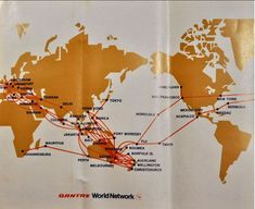 an open book with a world map on the front and back pages, showing routes