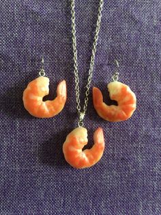 Shrimp Necklace and Earrings  Polymer Clay, 1" x 1" Earrings on rhodium ear wires  Necklace on 18" rhodium chain Shrimp Necklace, Earrings Polymer, Jewellery Sets, Wire Necklace, Earrings Polymer Clay, Necklace And Earrings, Ear Wires, Jewelry Sets, Polymer Clay