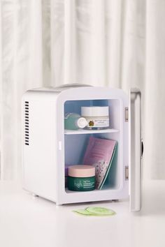 a white microwave oven sitting on top of a table