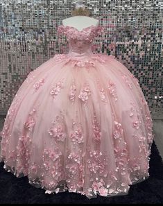 a pink ball gown with flowers on it