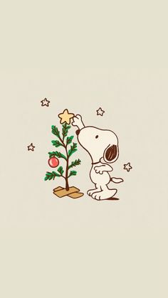 a snoopy christmas tree with a star on it's top and a dog standing next to it