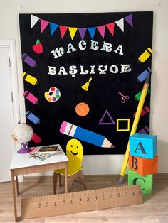 a child's room with a blackboard, ruler and toys on the floor